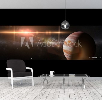 Picture of Planet Jupiter in front of the Milky Way galaxy and the Sun